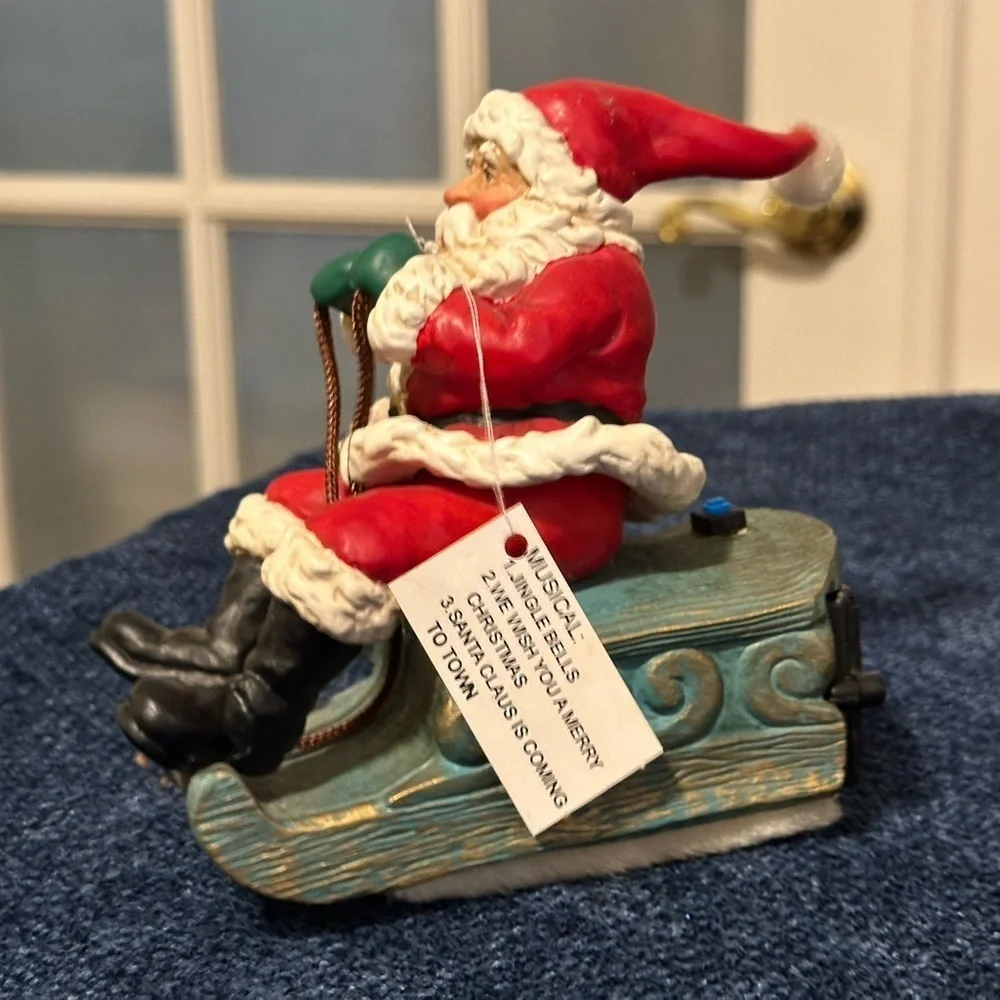 Musical vibrating Santa on his sleigh. Plays 3 songs!